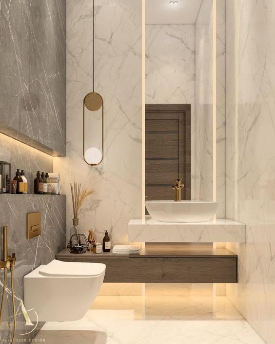 a modern bathroom with marble walls and flooring