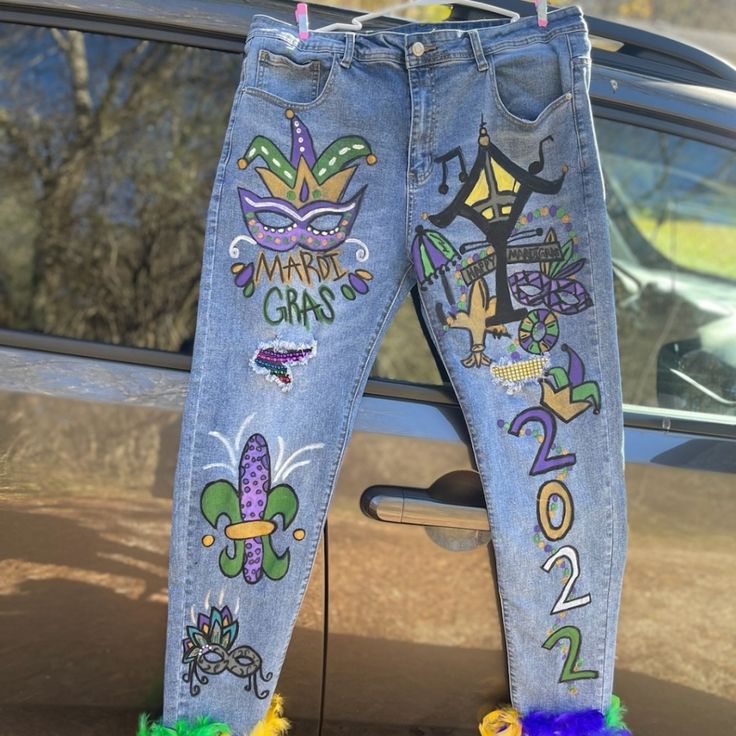 jeans decorated with mardi gras decorations hanging from a car