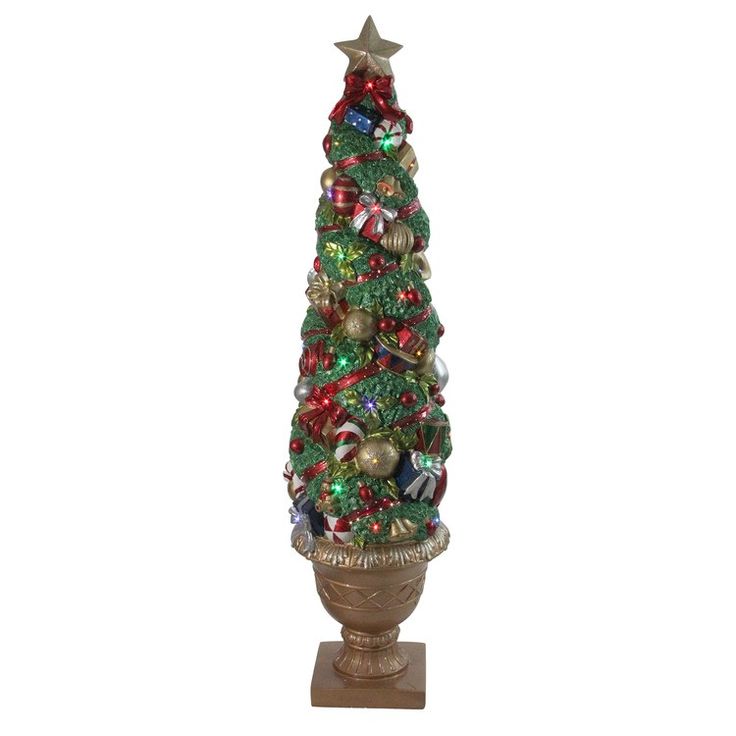 a small christmas tree is sitting in a vase with ornaments on the top and bottom