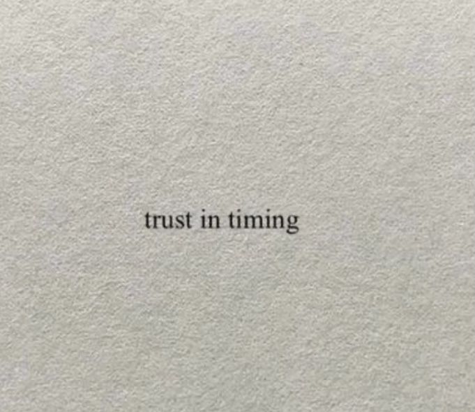 the words trust in time written on a piece of white paper with black writing above it