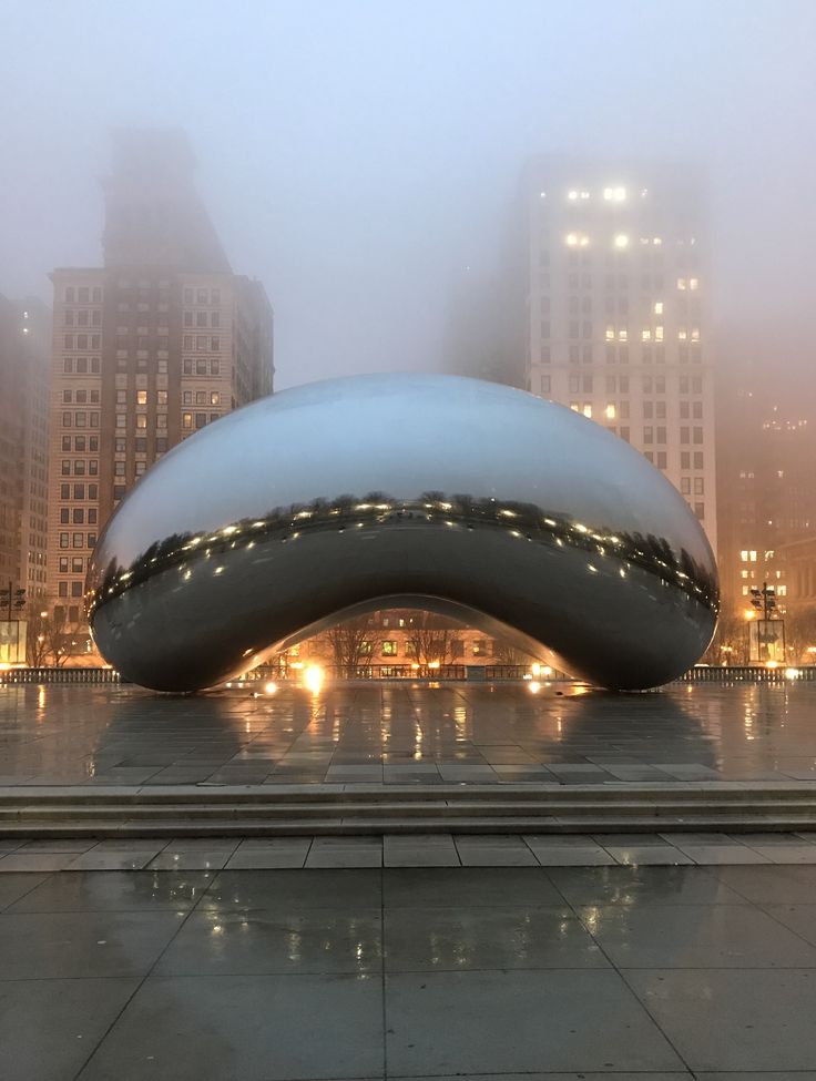 a large white object sitting in the middle of a city