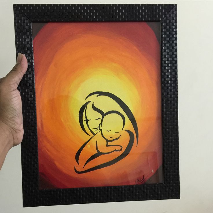 a person holding up a painting with a baby in it's arms and the sun behind them