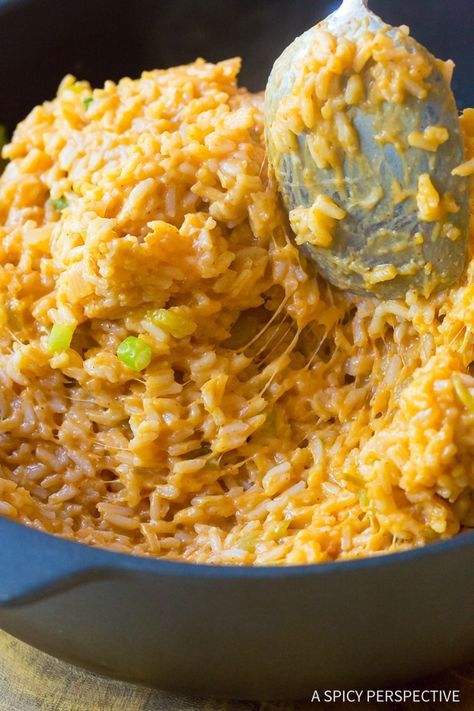 a spoon scooping rice into a bowl