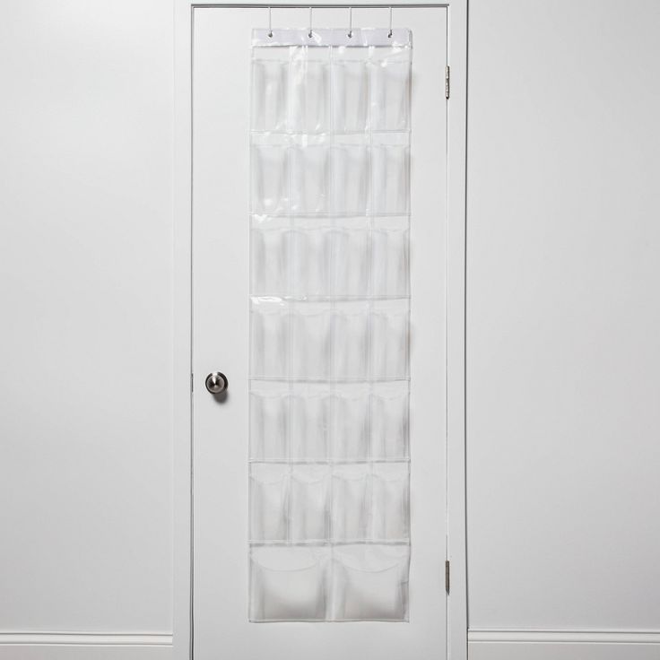 a white door with a clear curtain hanging from it's side