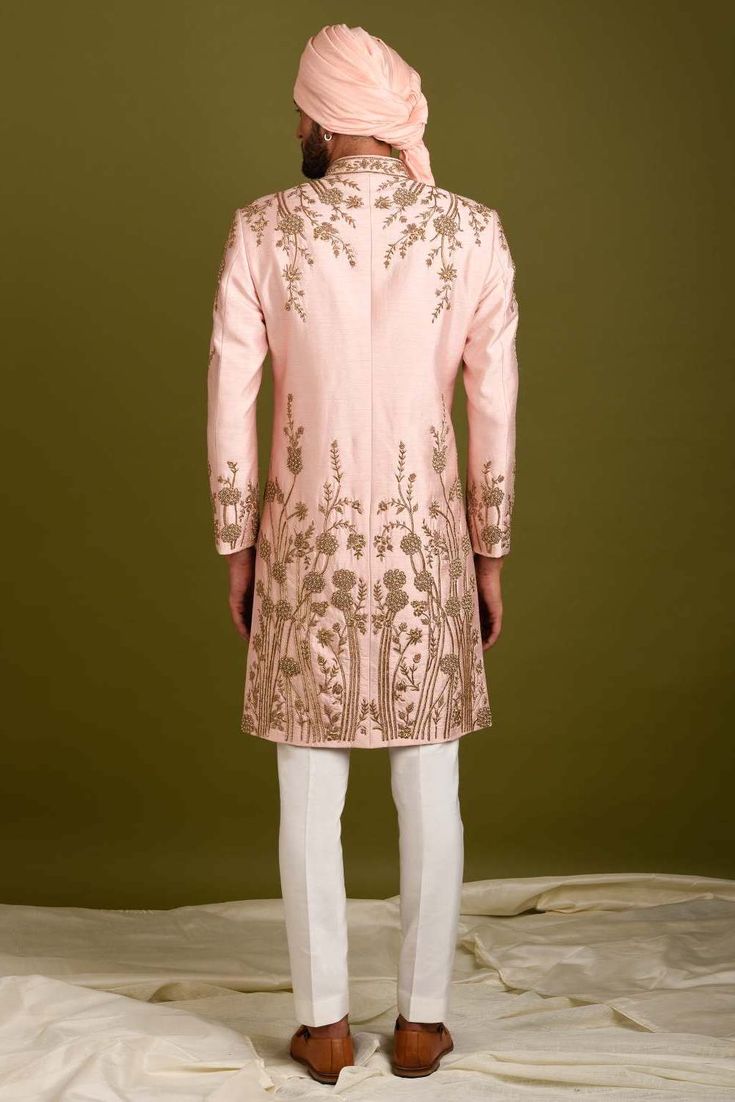 Editor's Note Pink-peach Sherwani In Silk Base With Floral Embroidery. It Is Paired With Contrasting Pyjama Pants. Color: Pink Peach Fabric: Silk Care: Dry Clean Only About the Designer Inspired By The Minimalism, Utilitarianism And Functionality, Chatenya Mittal Is A Label Focused Entirely On Menswear. Chatenya Mittal Is Revisiting The Classic Silhouette Bringing New Energy And Working To Create Future Classics By Subtly Combining Fabric Blocking, Layering, Attention To Detail And By Developing Pink Sherwani, Ivory Pants, Blouse Yoke, Pyjama Pants, Peach Fabric, Embroidery Floral, Pajama Pant, Silk Pajamas, Silk Embroidery