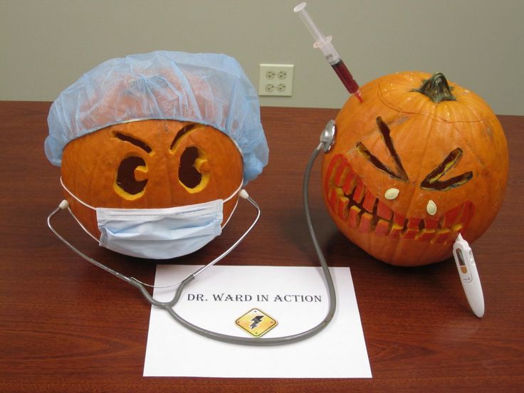 two pumpkins that have been carved to look like doctors