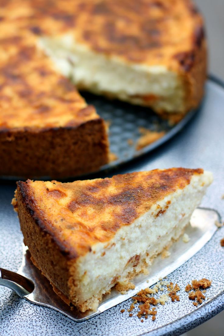 there is a cake that has been cut in half on the plate and ready to be eaten