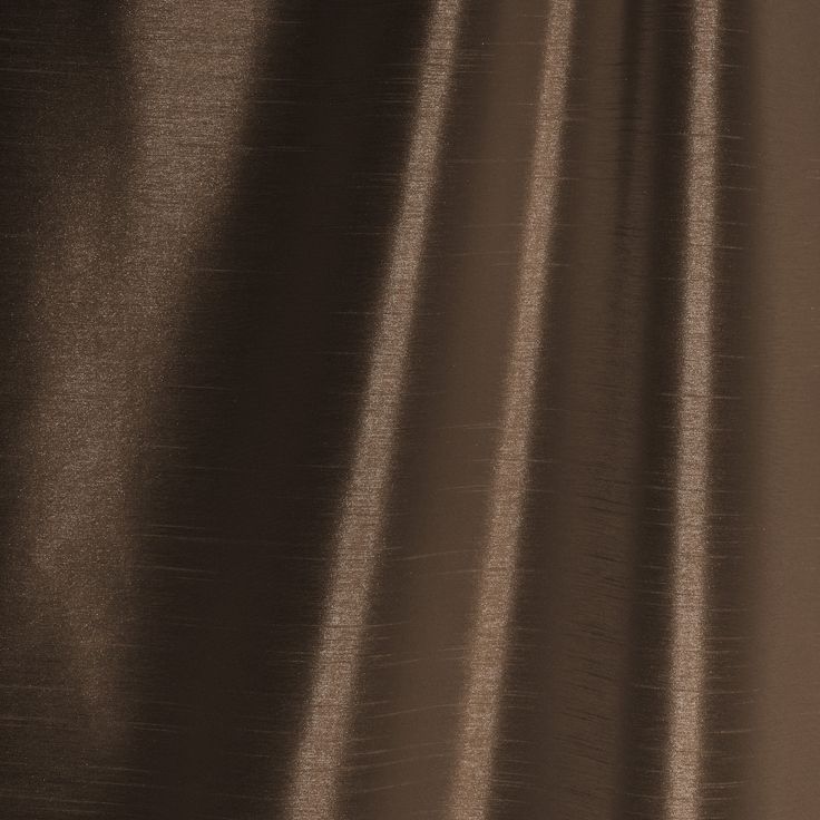 a close up view of a brown curtain with some lines on it and the fabric is very thin