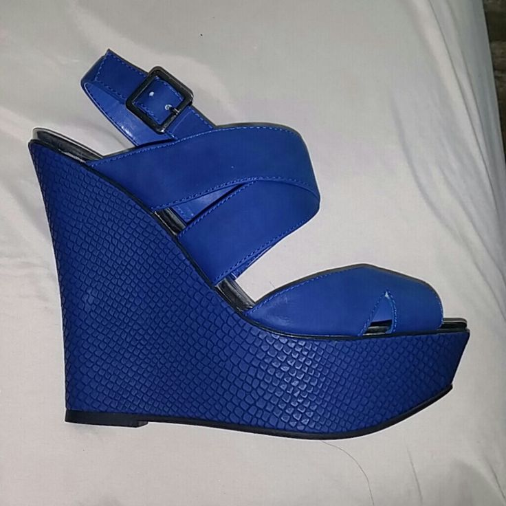 Royal Blue Brand New Never Worn Wedge Shoe Blue Wedge Sandals For Parties, Blue Synthetic Wedge Sandals For Spring, Trendy Blue Wedge Sandals With Round Toe, Chic Blue Wedge Sandals With Round Toe, Blue High Heel Wedge Sandals For Casual Wear, Blue Leather Wedge Sandals For Spring, Blue Ankle Strap Wedge Sandals For Spring, Chic Blue Round Toe Wedge Sandals, Blue Open Toe Wedge Sandals For Spring