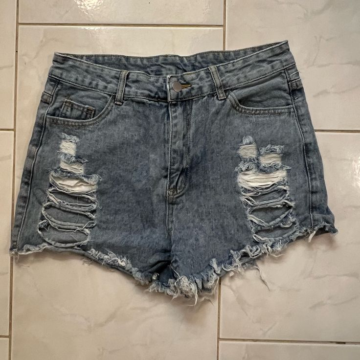 Shein Women’s Blue Denim Ripped/Distressed Jean Shorts Has Five Pockets And Frayed/Fringed Legs Size Large Excellent Never Worn Condition Ripped Cutoff Bottoms In Grunge Style, Ripped Cutoff Grunge Bottoms, Medium Wash Ripped Grunge Bottoms, Grunge Ripped Medium Wash Bottoms, Grunge High-rise Jean Shorts With Frayed Hem, Ripped Denim Grunge Bottoms, Trendy Ripped Denim Jean Shorts, Grunge Ripped Denim Bottoms, Ripped High-waisted Jean Shorts In Medium Wash