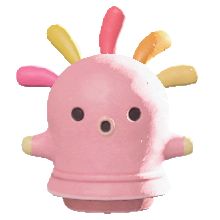 a pink toy with multicolored spikes on it's head