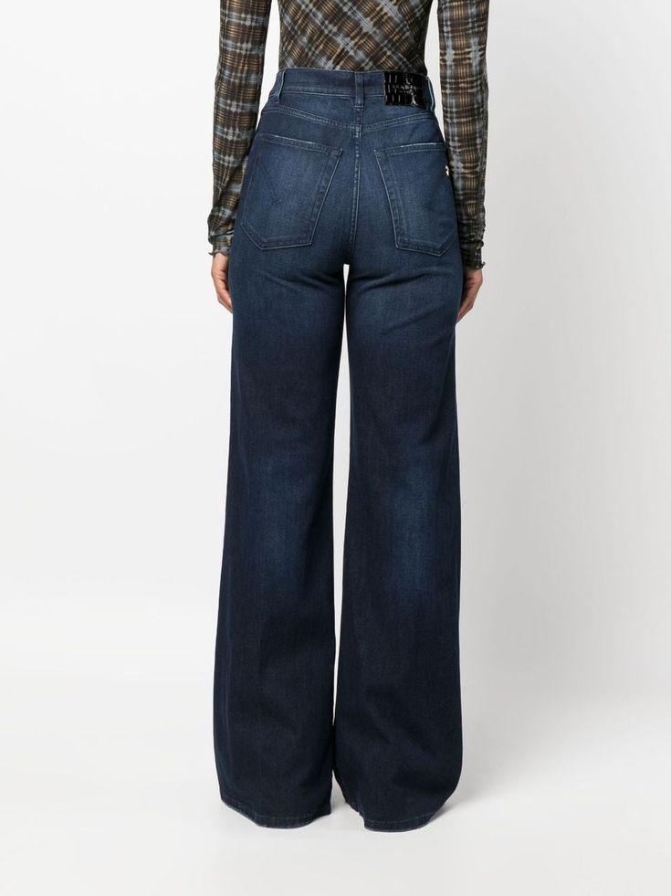 high-waisted wide-leg jeans from DONDUP featuring indigo blue, cotton blend, denim, high-waisted, belt loops, front button and zip fastening, classic five pockets and wide leg. Size Info JEANS (WAIST) Color Detail Blue Made In Italy Material Outer: Cotton 92%, Elastomultiester 6%, Elastane 2% Lining: Polyester 65%, Cotton 35% Season One Fall-Winter Season Two Fall-Winter Product jeans Brand Dondup Size And Fit This piece fits true to size. We recommend you get your regular sizeModel is 1,75m / 5 Trench Dress, Trench Jacket, Cape Coat, Blazer With Jeans, Jeans Jumpsuit, Knitwear Cardigan, Pant Shirt, Wide Leg Denim, Jeans Brands