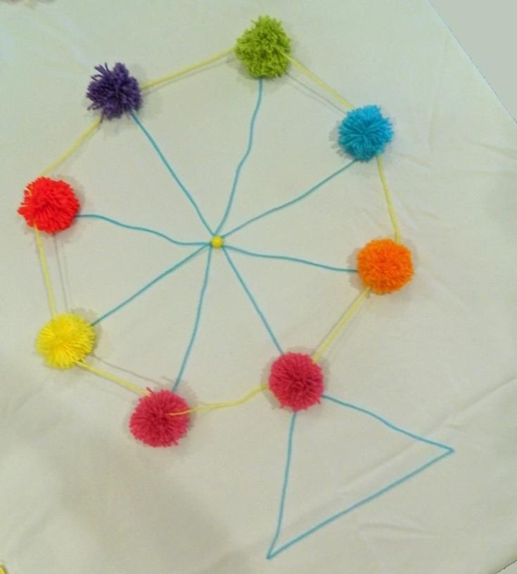 a group of pom - poms arranged in a circle on top of a table