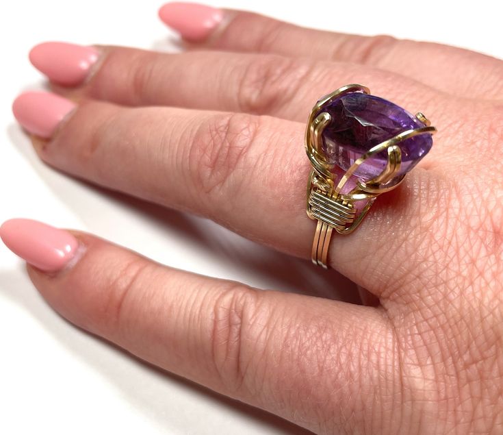 Curated by The Lady Bag Ladies A piece of art on your finger... Gorgeous 14k yellow gold amethyst ring. This beauty is an absolute statement piece as it holds a nine carat purple amethyst! The beautiful stone is set in a 14k yellow gold wire-wrapped setting. * Excellent condition * Size 7 (free sizing available)* Weighs 4.9 grams All rings are sold in the current size. Please contact us via email if you would like it sized before shipping. We thought it would be fun to go back to our roots. The Yellow Gold Amethyst Ring, Gold Amethyst Ring, Leather Formal Shoes, Three Daughters, Gold Wire, The Lady, Amethyst Ring, Purple Amethyst, Yellow Gold Rings