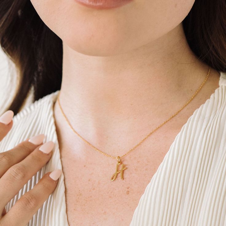 Add a personal touch to your next outfit with the Nella Initial Pendant. Simple and classic, this custom necklace will become a new daily staple. Available in sterling silver, 18k gold plated or 18k rose gold plated silver Initial size: 1/2" tall, width varies 16" cable chain with 2" extender This is an uppercase only font, lowercase letters entered will be produced as uppercase This item is FINAL SALE and ships 3-5 business days from the order date SKU: BYN1138 Rose Gold Initial Pendant Necklace With Cable Chain, Cable Chain Pendant Initial Necklace Gift, Yellow Gold Initial Necklace With Cable Chain As Gift, Minimalist Name Necklace With Cable Chain As Gift, Minimalist Name Necklace With Cable Chain For Gift, Dainty Sterling Silver Initial Necklace With Cable Chain, Yellow Gold Sterling Silver Initial Necklace With Cable Chain, Sterling Silver Name Necklace With Cable Chain, Initial Pendant Cable Chain Jewelry For Gift