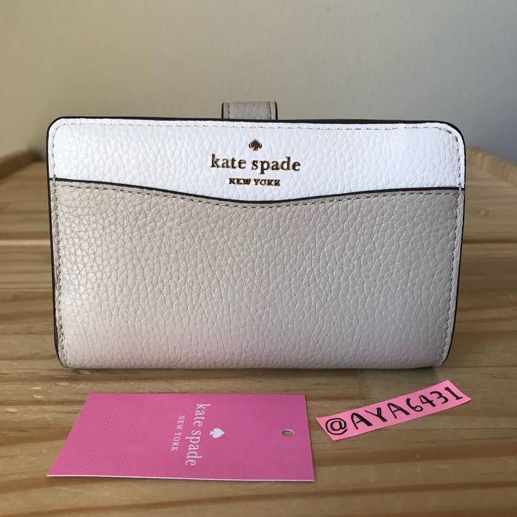 100% Authentic Kate Spade K6396 Leila Colorblock Medium Compact Bifold Wallet Light Sand And Gold Hardware **Brand New With Tags** 5 3/4” L X 3.5” H White Rfid Blocking Wallets, White Rfid Blocking Wallets For Everyday, Everyday White Leather Wallet, White Leather Everyday Wallet, White Bifold Wallet With Rfid Blocking, Modern White Bifold Wallet, Kate Spade Beige Wallet For Everyday Use, Kate Spade Beige Wallets For Everyday Use, White Rfid Blocking Rectangular Wallet