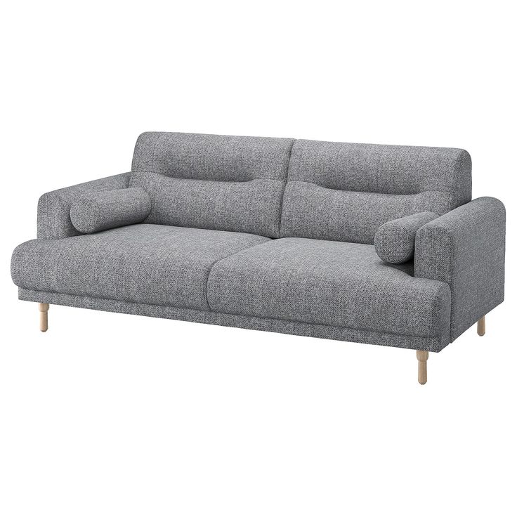 a gray couch sitting on top of a white floor