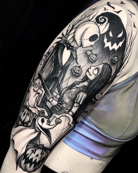 a woman's arm with a black and white tattoo on it