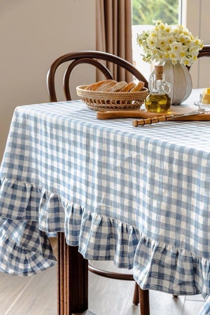 a blue and white checkered table cloth on a wooden chair