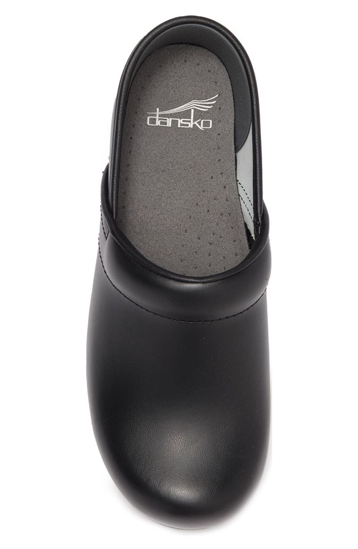 A comfy pair of supported clog shoes made from durable leather offer a versatile, timeless style for any outfit. 2" heel; 0.75" platform Round toe Slip-on Cushioned insole Leather upper, PU sole Imported Classic Black Slip-on Clogs, Classic Black Clogs With Cushioned Footbed, Black Clogs With Leather Footbed For Work, Classic Slip-on Clogs With Ortholite Insole, Classic Slip-resistant Clogs With Round Toe, Black Leather Clogs With Arch Support, Classic Black Synthetic Clogs, Classic Leather Clogs Medium Width, Slip-resistant Closed Toe Clogs For Workwear