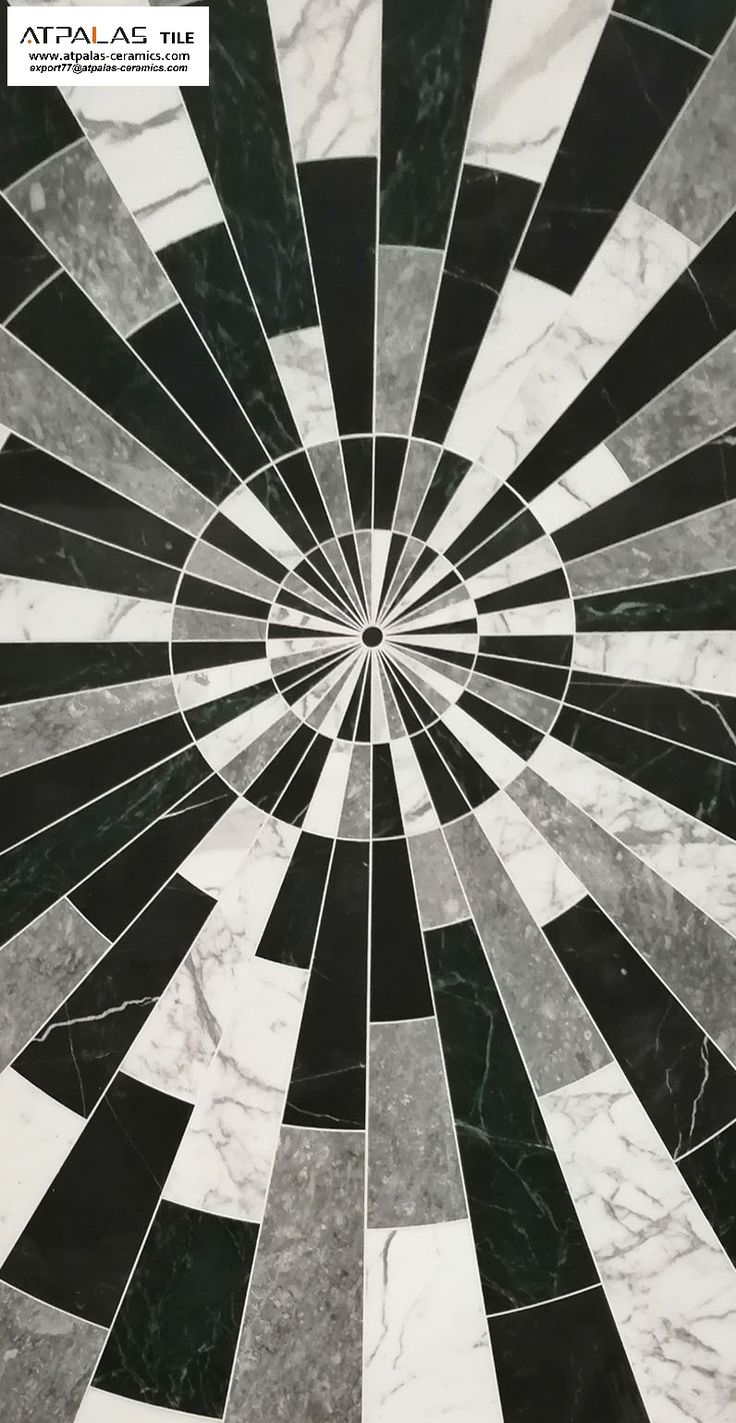 a black and white marble floor with an abstract design