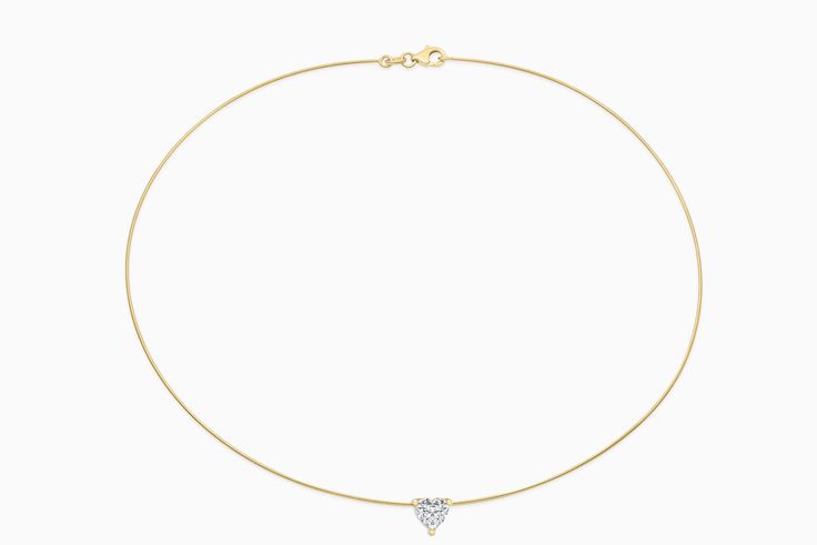 Introducing our stunning Essential Solitaire Necklace, a masterpiece of timeless beauty and personalised elegance. This piece features a 1-carat natural diamond on a sleek omega chain, adding a modern touch to classic sophistication. If you're interested in this piece with a specific diamond quality, color or size, please reach out to our custom team at info@cayejoaillier.com for more information. Please note: Omega styles are inherently fragile and require gentle handling. Avoid bending or pulling, and store them flat to prevent any harm to the chain. Please be aware that this item is not covered for repair or replacement under Caye Joaillier's warranty terms. Gold Quality: 18ktDiamond Weight: Approximately 1.00-1.05 ct. Diamond Quality: Si2 Diamond Color: H+ Modern Single Diamond Necklace For Wedding, Modern Single Diamond Wedding Necklace, Fine Jewelry Pendant Necklace With Tension Setting, Elegant Heart Pendant Diamond Necklace For Formal Occasions, Elegant White Gold Necklace With Tension Setting, Elegant Formal Heart Pendant Diamond Necklace, Elegant Diamond White Necklaces With Tension Setting, Elegant Yellow Gold Heart Pendant Solitaire Necklace, Elegant Yellow Gold Solitaire Heart Pendant Necklace