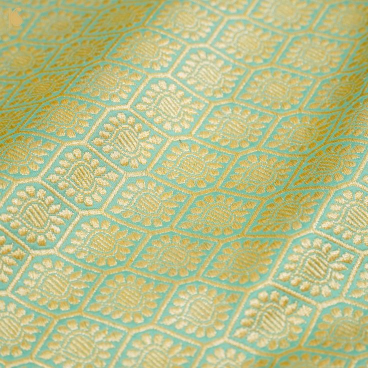 Banarasi Rangkat sarees are a magnificent blend of Banarasi silk and intricate Rangkat weaving, originating from Varanasi. These sarees are adorned with colorful silk threads that are intricately woven into elaborate motifs that represent traditional Indian patterns. They are also embellished with exquisite zari work and are highly valued for weddings and formal events, symbolizing luxury and cultural heritage. Skilled artisans craft these sarees, which are timeless masterpieces that reflect the Meenakari Saree, Silk Banarasi Saree, Handloom Weaving, Indian Patterns, Banarasi Silk Saree, Background Fabric, Indian Textiles, Katan Silk, Banarasi Saree