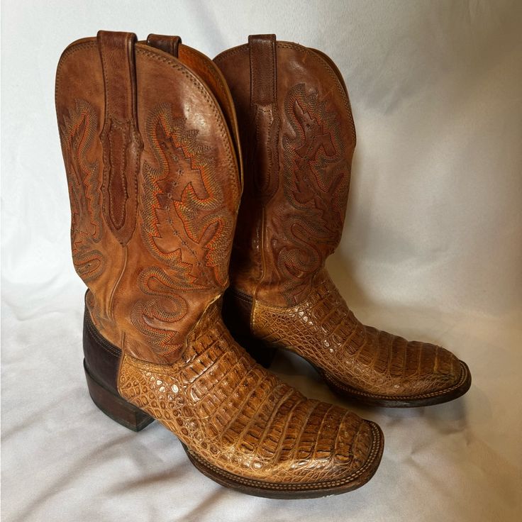 These Lucchesse Caiman Boots Are A Must-Have For Any Western Enthusiast. Featuring Elegant And Eye Catching Design Outlined By Contrast Orange Stitching On A Richly Colored Quarter, The 10d Shoe Width Ensures A Comfortable Fit. Handmade In Mexico Since 1883, This Boot Offers A Double Welt Construction And A Main Belly Vamp. These Boots Are Preloved In Great Condition. All Signs Of Wear Depicted In Photos. Whether You're A Cowboy Or Just Someone Who Loves Western Culture, These Boots Are Sure To Designer Brown Snip Toe Boots, Luxury Brown Snip Toe Boots, Western Brown Boots For Business, Western Style Brown Boots For Business, Western Style Brown Business Boots, Brown Western Cap Toe Boots, Italian Brown Boots With Round Toe, Western Business Boots With Leather Sole, Caiman Boots