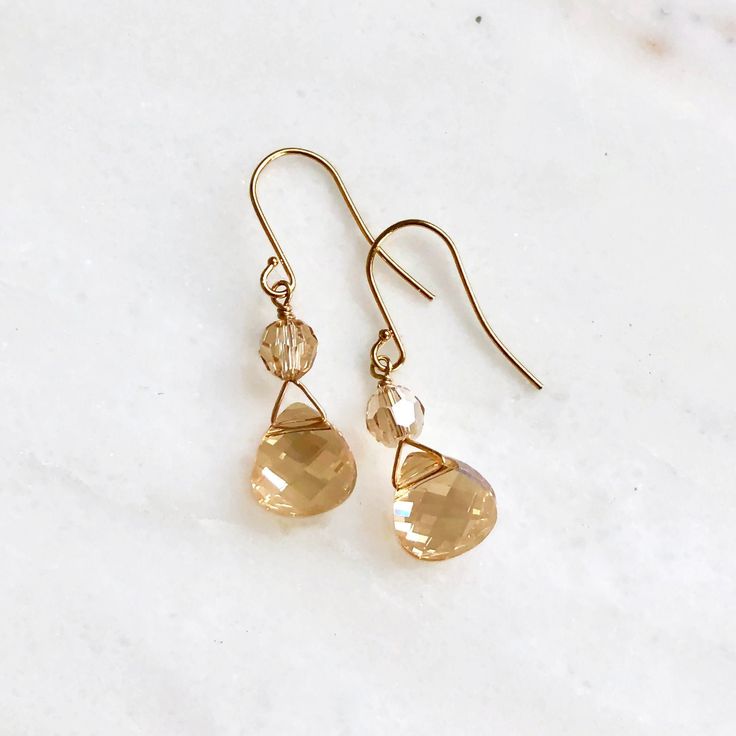 Two beautiful Swarovski crystal flat briolettes in the golden shadow shade have been paired with gold-plated findings. Twinkling above the briolettes are two matching round crystals. These earrings were gifted (via The Artisan Group) to the stylist of the Netflix show Firefly Lane and seen on actress Sarah Chalke playing Kate Mularkey in episodes 101, 106, and 110. Copyright © 2021, all rights reserved. LoveYourBling® is an authorized SWAROVSKI® Crystals Branding Partner. Diy Earrings Pearl, Sarah Chalke, Firefly Lane, Briolette Earrings, Gold Filigree Earrings, Crystal Teardrop Earrings, Golden Shadow, Bijoux Fil Aluminium, Netflix Show