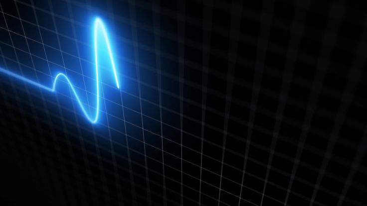 an image of a heart beat sign on a black background with blue lines in the shape of a wave