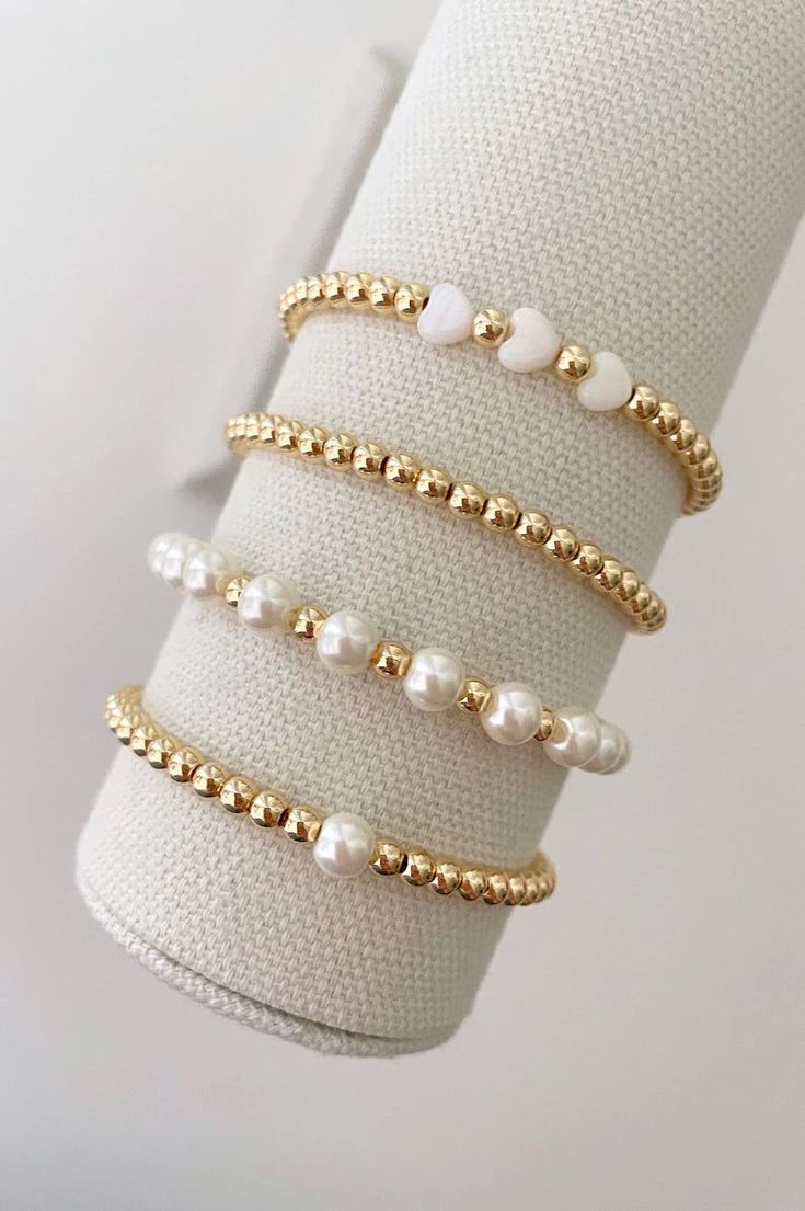 one pearl stacking bracelet with 14k gold beads bracelets are made on a durable stretch elastic cord please refer to our sizing guide before purchasing Pearl Bracelet With Words, Gold Bracelets Beads, Beaded Bracelet For Girls, Stretch Pearl Bracelets, Good Beaded Bracelets, Trendy Bead Bracelets, Pearl Stack Bracelets, Pearl And Gold Bracelet Stack, Pearl And Bead Bracelet