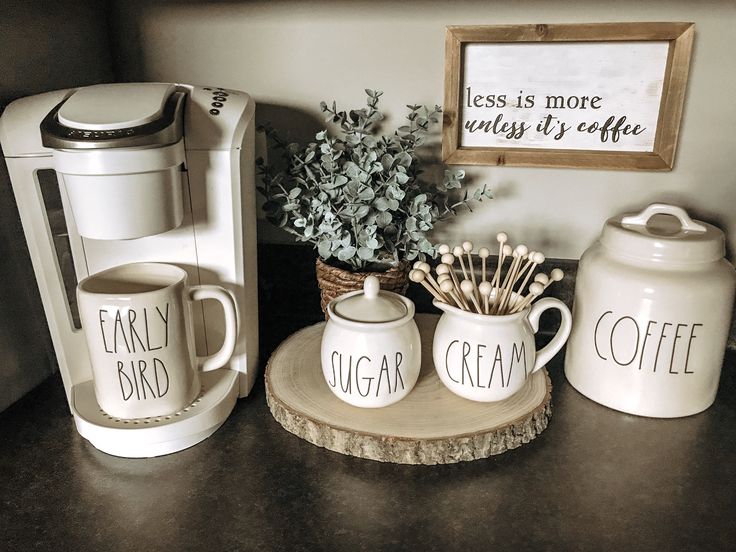 coffee mugs and cups are sitting on a counter