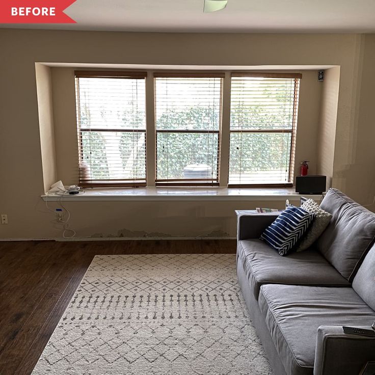 the living room is clean and ready to be used as a den or office space