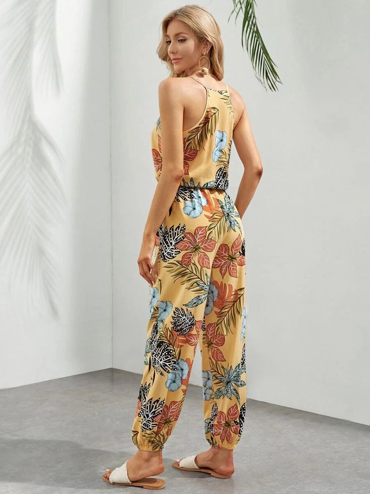 This gorgeous boho-style Tropical Print Cami Jumpsuit is the perfect choice for your next tropical getaway! The long length and regular fit provide a flattering silhouette, while the spaghetti straps and sleeveless design keep you cool and comfortable. The all-over tropical pattern adds a stylish touch that you'll like. Whether you're lounging on the beach or heading out for a night on the town, this dress will have you looking and feeling your best. Specifications: Style: Boho Pattern Type: Tro Cami Jumpsuit, Comfy Jumpsuits, Clean Body, Tropical Getaways, Boho Patterns, Mode Boho, Tropical Pattern, Long Length, Tropical Print