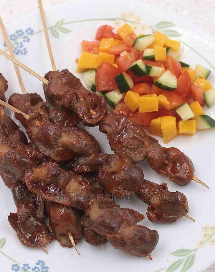 skewers of meat and vegetables on a plate