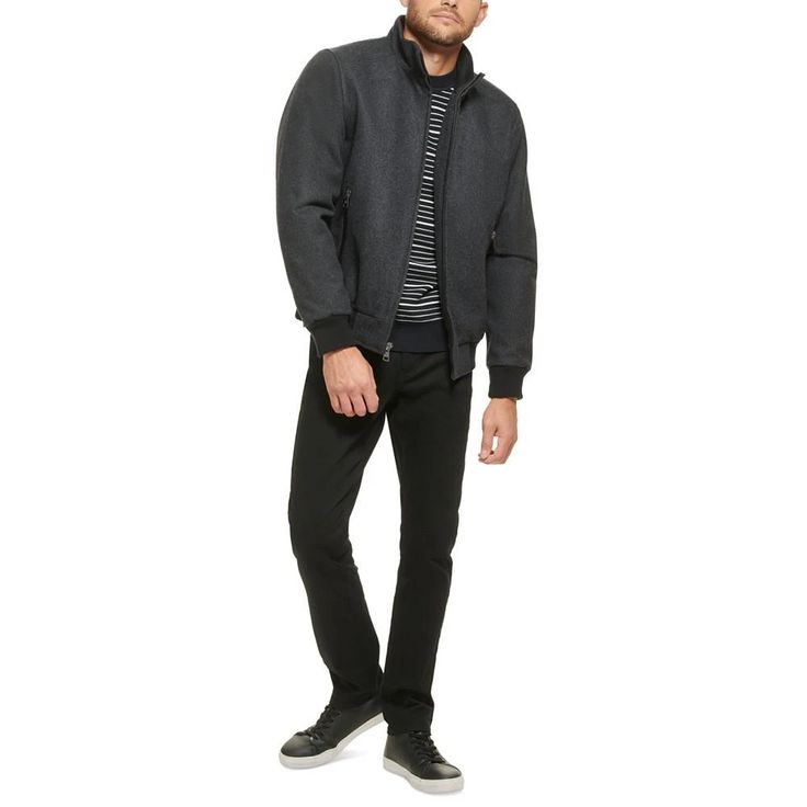 This wool bomber jacket with knit trim is a versatile coat that can be worn anywhere, from the boardroom to a night out on the town. It is a classic style that is sure to impress with its timeless look and sleek fabric. Heading to work or off the clock, keep warm while looking fashionably modern with this versatile bomber coat from Calvin Klein..Medium weight.Sits at waist.Regular fit.Stand collar; Zip-front closure.Single entry hand pockets with zipper closure.Inner channel quilt lining; Metal logo at back neck; Open cuffs with knit rib detail; Seam details at shoulder.Shell: Wool/polyester/nylon/acrylic/other fiber; Body lining: Nylon; Sleeve lining: Polyester.Dry clean only.Imported Winter Business Outerwear With Ribbed Cuffs, Classic Wool Varsity Jacket With Ribbed Collar, Fitted Wool Varsity Jacket For Winter, Classic Calvin Klein Outerwear For Business, Calvin Klein Classic Outerwear For Business, Classic Calvin Klein Business Outerwear, Classic Winter Varsity Jacket With Ribbed Collar, Classic Varsity Jacket With Ribbed Collar For Winter, Winter Wool Varsity Jacket With Ribbed Collar