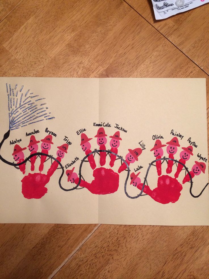 handprints are arranged on top of a piece of paper