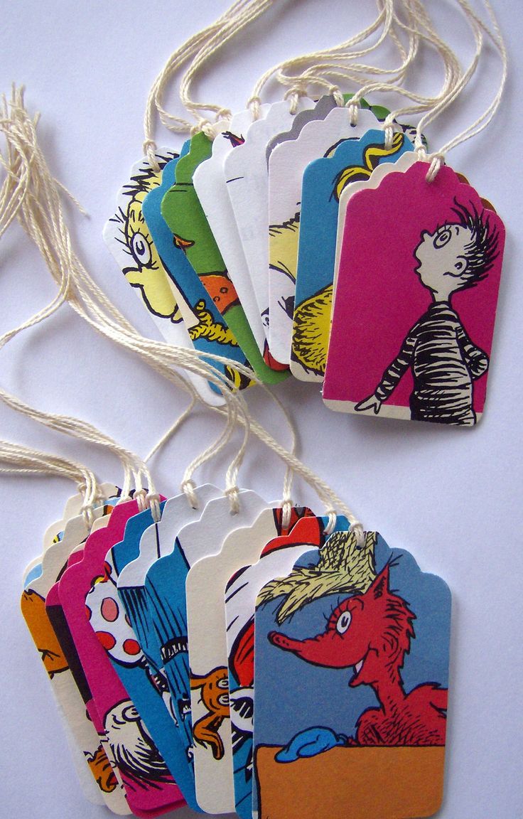 the dr seuss bookmarks are hanging from strings on a white surface with string