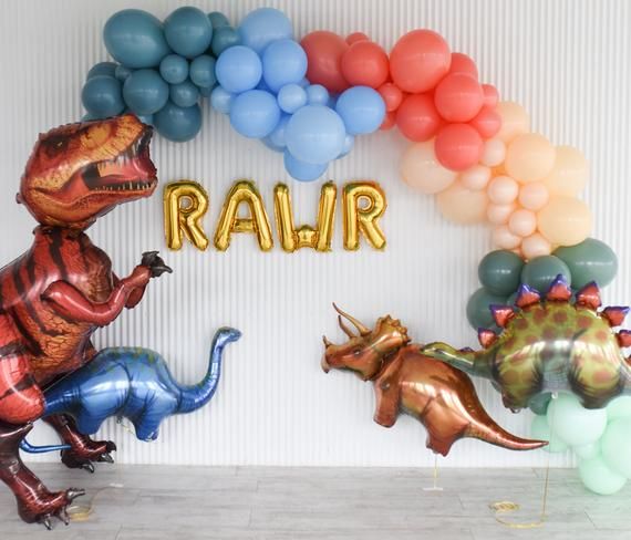 some balloons that are in the shape of dinosaurs