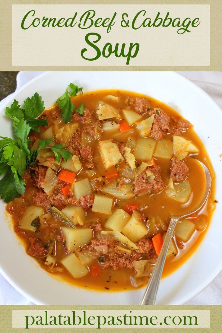 a white plate topped with meat and cabbage soup