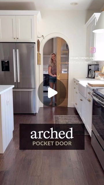 a woman standing in a kitchen next to an oven and refrigerator with the words arched pocket door on it