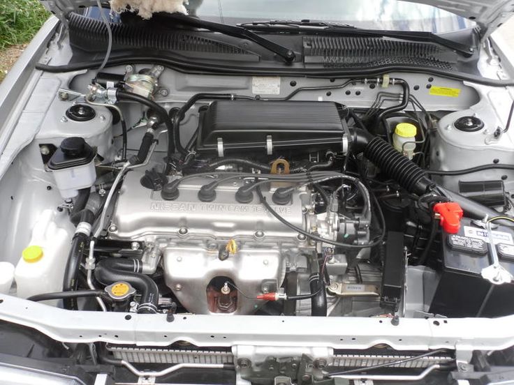 the engine compartment of a car with its hood open