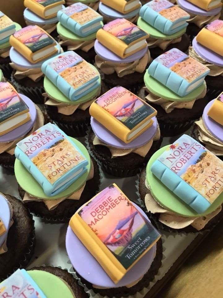 there are many cupcakes with books on them