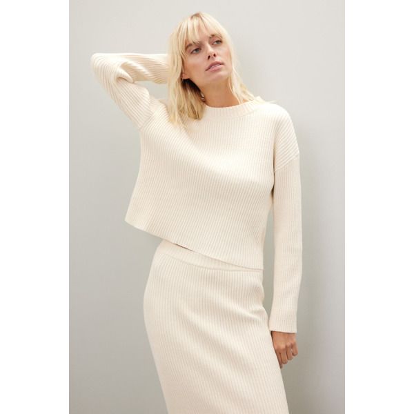 Cream knit (100% Polyester). Sweater. Long sleeves. Crewneck. Pull on. Imported. Elegant Spring Sweater With Ribbed Neckline, Chic Winter Sweater With Ribbed Neckline, Cozy Sweater With Ribbed Neckline For Work, Chic Cream Sweater With Ribbed Neckline, Chic Sweater With Ribbed Collar For Spring, Chic Long Sleeve Sweater With Ribbed Neckline, Beige Ribbed Crew Neck Outerwear, Beige Ribbed Stretch Sweater, Elegant Ribbed Cropped Sweater For Spring