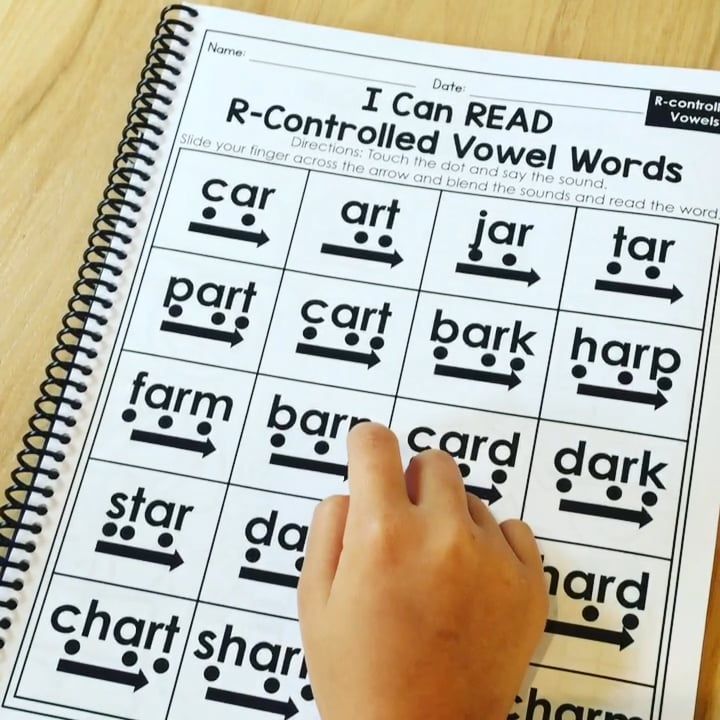 a hand is pointing at the words that are in front of them on a worksheet