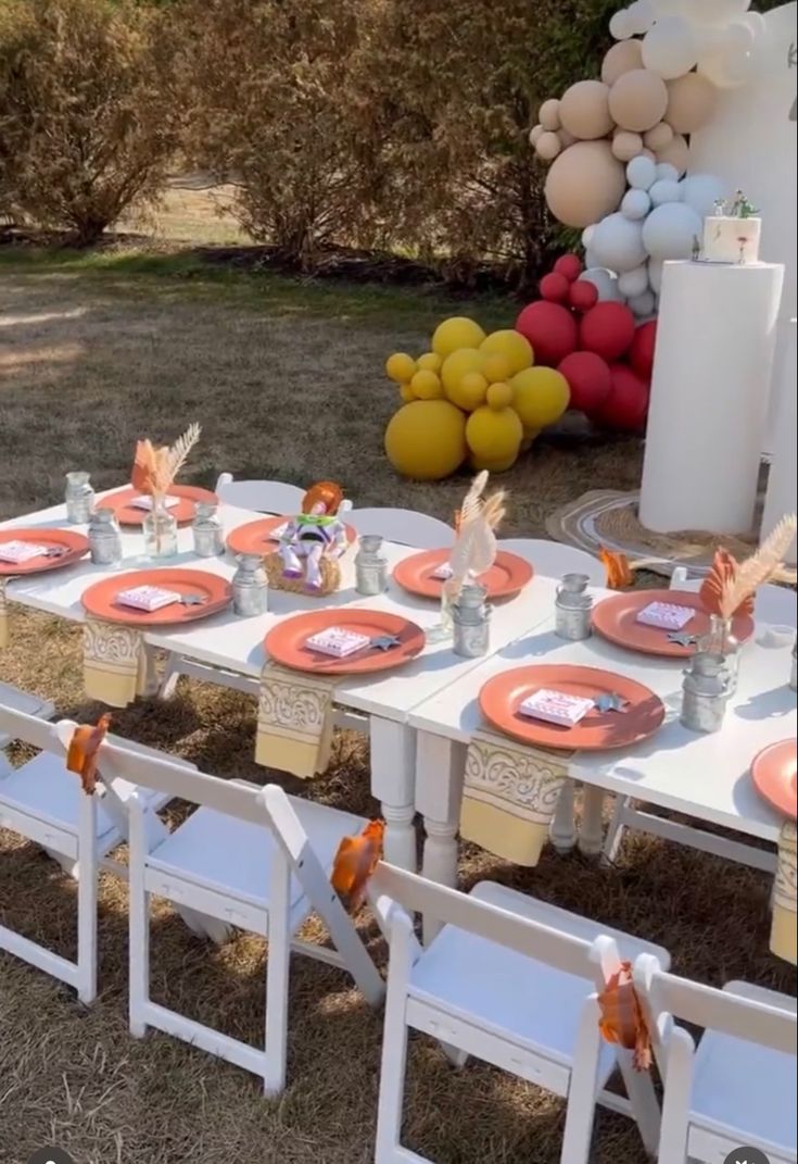 an outdoor table set up for a party