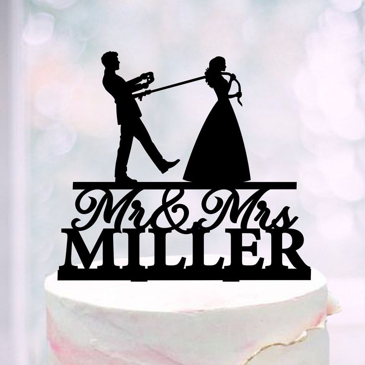 a wedding cake topper that says mr and mrs miller with a silhouette of a bride and groom