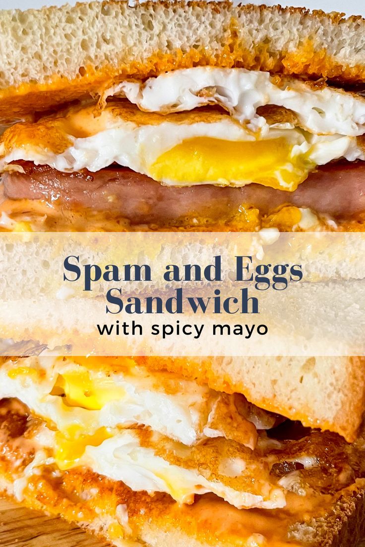 an egg sandwich with spicy mayo and bacon on toasted bread is shown in the foreground