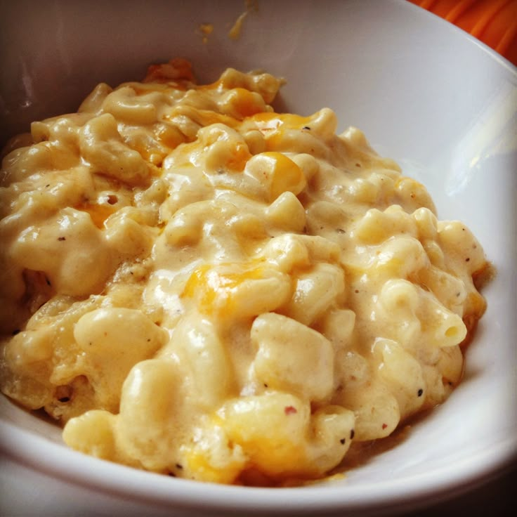 a white bowl filled with macaroni and cheese