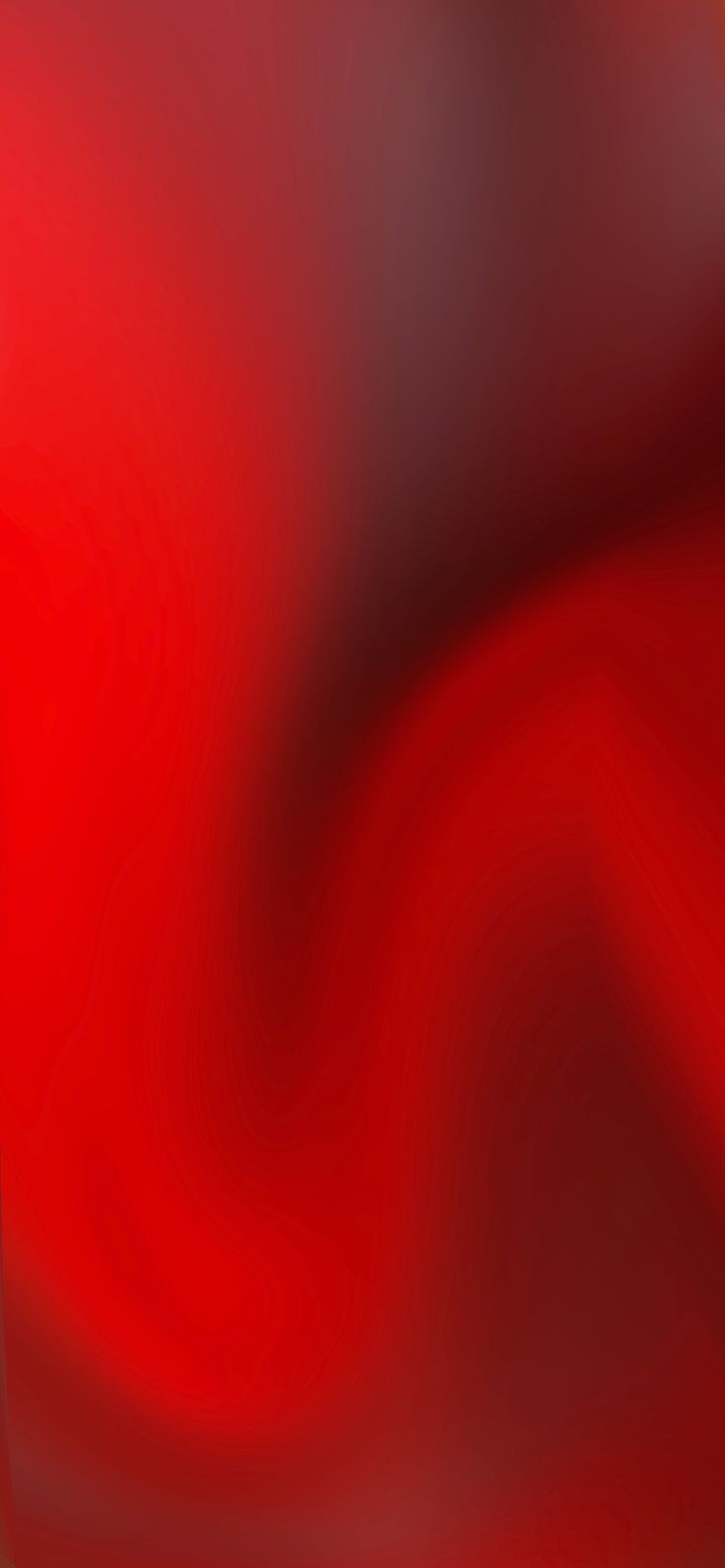 a blurry red and black background with an abstract design